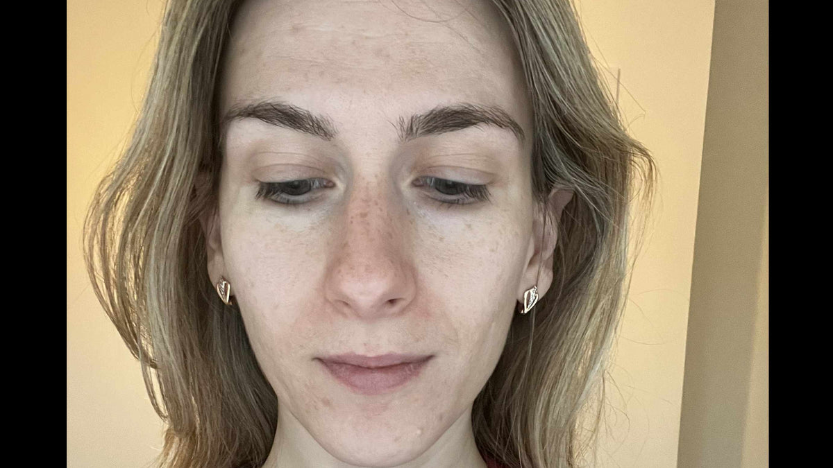 Before - Person wearing a red sweatshirt with a neutral background